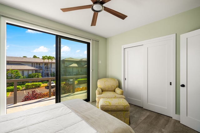 1647 Kelaukia St, Koloa, HI 96756 - bedroom featuring wood finished floors, a closet, a ceiling fan, and access to exterior