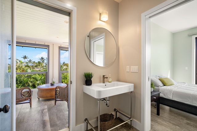 1647 Kelaukia St, Koloa, HI 96756 - bathroom featuring wood finished floors, a sink, and baseboards