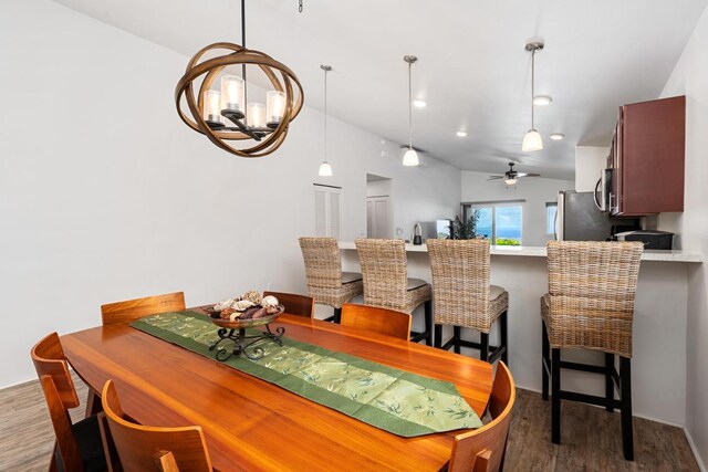 73-3725 Kaimalolo Pl, Kailua-Kona, HI 96740 - dining area featuring dark wood-style floors, a chandelier, and ceiling fan