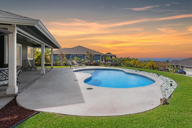 73-3725 Kaimalolo Pl, Kailua-Kona, HI 96740 - pool at dusk featuring a patio area, an outdoor pool, and a lawn