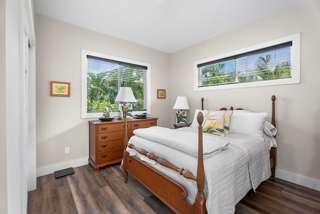 75-5726 Lamaokeola St, Kailua-Kona, HI 96740 - bedroom featuring multiple windows, dark wood-type flooring, and baseboards