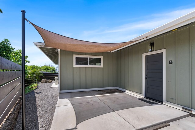 75-5726 Lamaokeola St, Kailua-Kona, HI 96740 - property entrance featuring board and batten siding and a patio