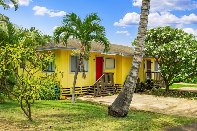 4724 Menehune Rd, Waimea, HI 96796 - view of front of property with a front yard and roof with shingles