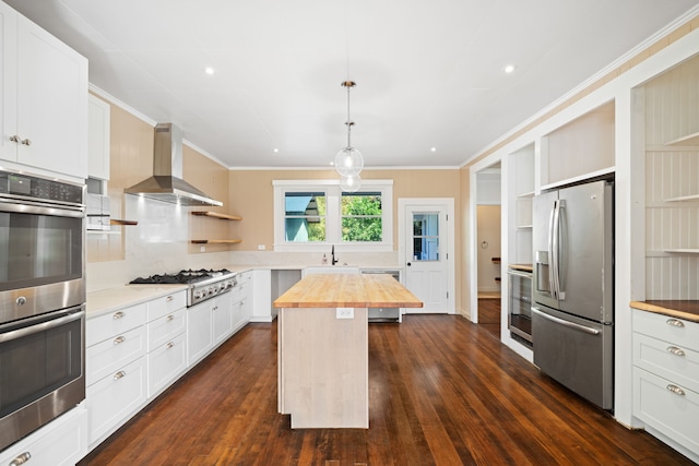 3018 Poipu Rd, Koloa, HI 96756 - kitchen featuring appliances with stainless steel finishes, butcher block countertops, open shelves, wall chimney range hood, and dark wood-style flooring