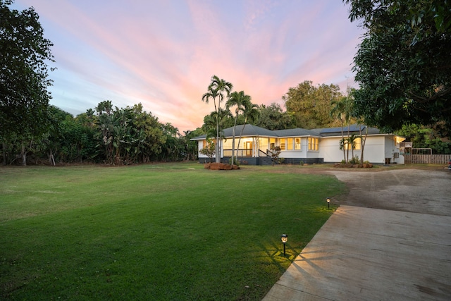 3018 Poipu Rd, Koloa, HI 96756 - single story home with concrete driveway, roof mounted solar panels, and a front yard
