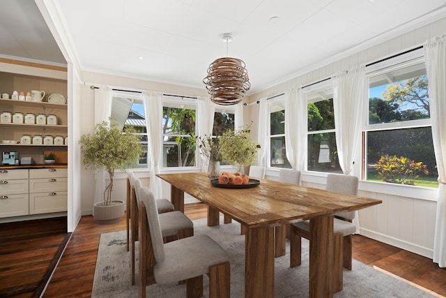 3018 Poipu Rd, Koloa, HI 96756 - dining space with dark wood finished floors, a chandelier, and ornamental molding