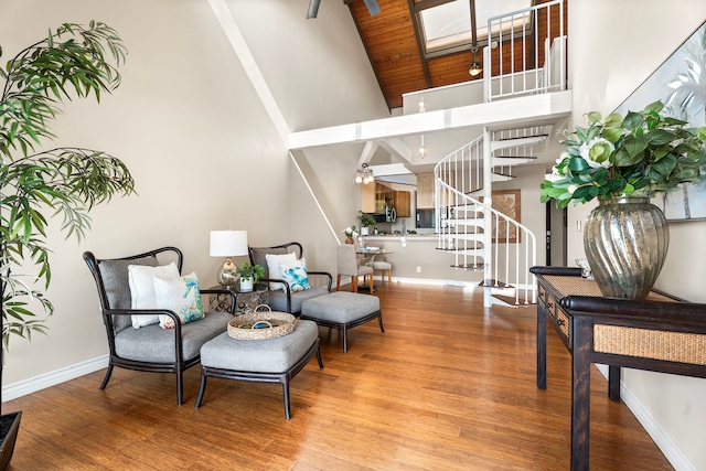 77-301 Noelani Way Unit 36, Kailua-Kona, HI 96740 - sitting room with stairs, high vaulted ceiling, wood finished floors, baseboards, and a skylight