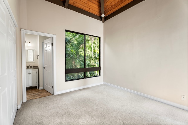 77-301 Noelani Way Unit 36, Kailua-Kona, HI 96740 - spare room with wooden ceiling with exposed beams, carpet flooring, high vaulted ceiling, and baseboards