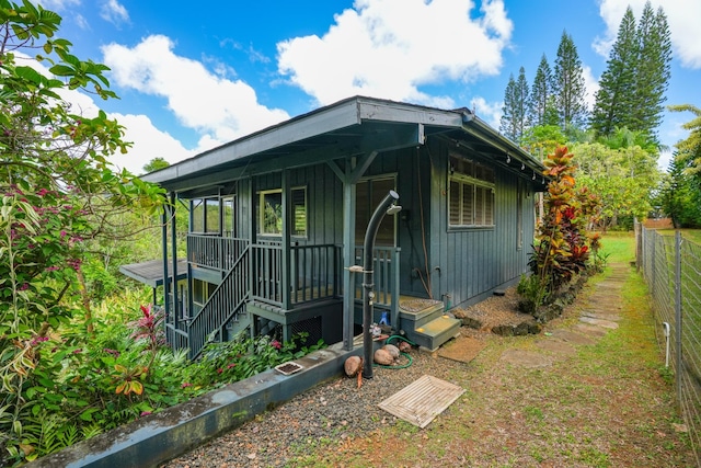 6052 Hauiki Rd Unit 1, Kapaa, HI 96746 - view of front facade featuring board and batten siding and a porch