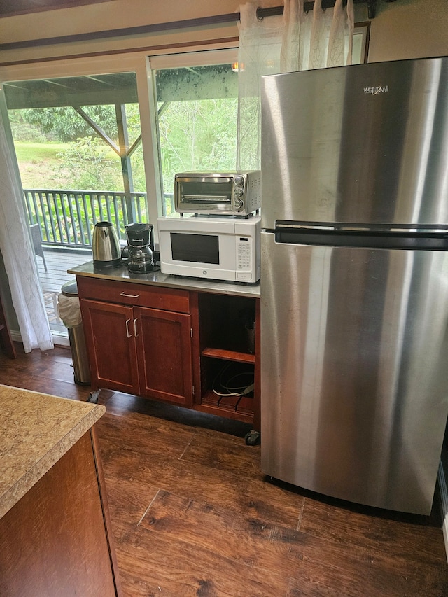 6052 Hauiki Rd Unit 1, Kapaa, HI 96746 - kitchen with freestanding refrigerator, white microwave, and dark wood finished floors