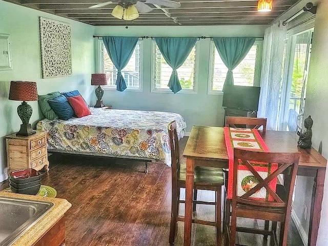 6052 Hauiki Rd Unit 1, Kapaa, HI 96746 - bedroom with multiple windows and wood finished floors