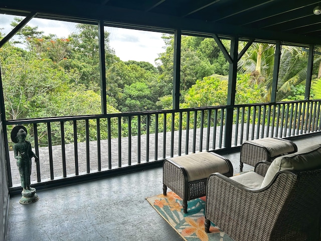 6052 Hauiki Rd Unit 1, Kapaa, HI 96746 - sunroom / solarium featuring healthy amount of natural light and a wooded view