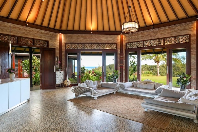 7218-C Koolau Rd, Kilauea, HI 96754 - living area with a high ceiling and a chandelier