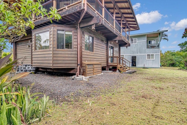 12-7158 Loke Pl, Pahoa, HI 96778 - view of home's exterior with a balcony and a yard