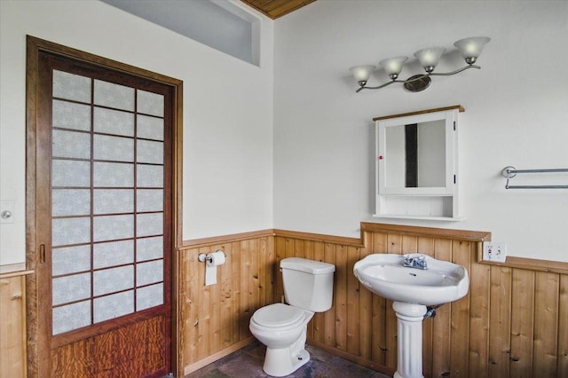 12-7158 Loke Pl, Pahoa, HI 96778 - half bath with wainscoting, toilet, wooden walls, and a sink