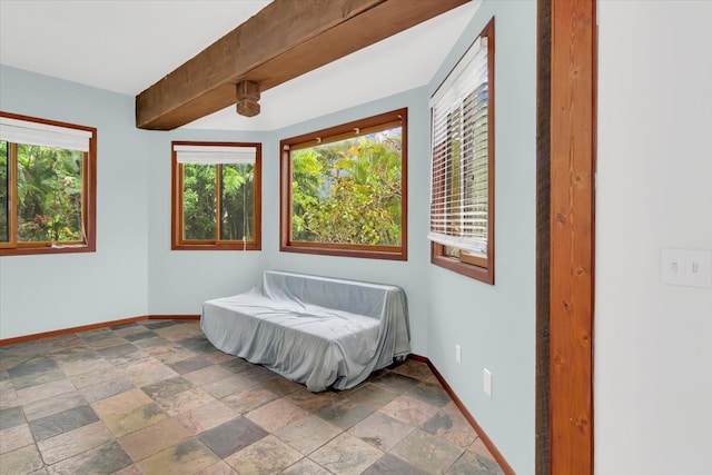 12-7158 Loke Pl, Pahoa, HI 96778 - bedroom featuring baseboards, stone tile flooring, and beam ceiling