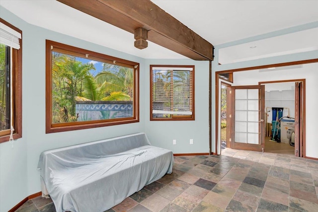 12-7158 Loke Pl, Pahoa, HI 96778 - bedroom featuring baseboards, stone finish floors, and a walk in closet
