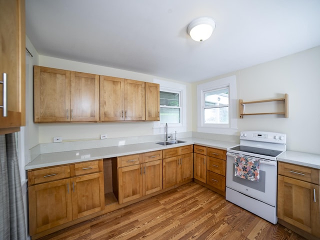 45-3345 Ulu St, Honokaa, HI 96727 - kitchen with electric range, a sink, light wood-type flooring, light countertops, and open shelves