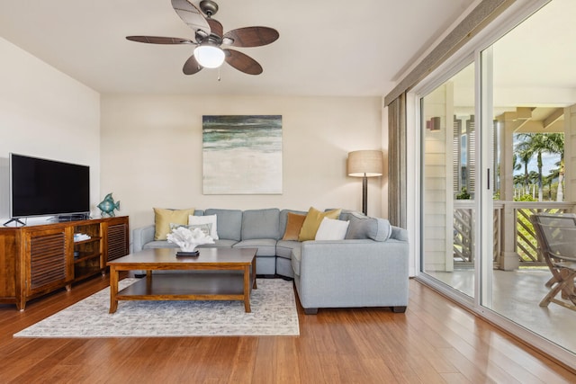 2611 Kiahuna Plantation Dr Unit 2I, Koloa, HI 96756 - living room with a ceiling fan and wood finished floors