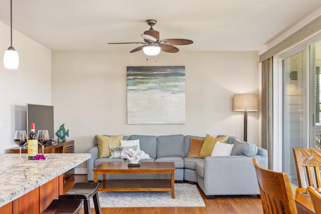 2611 Kiahuna Plantation Dr Unit 2I, Koloa, HI 96756 - living room with ceiling fan and wood finished floors
