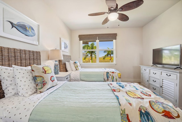 2611 Kiahuna Plantation Dr Unit 2I, Koloa, HI 96756 - bedroom featuring baseboards and ceiling fan