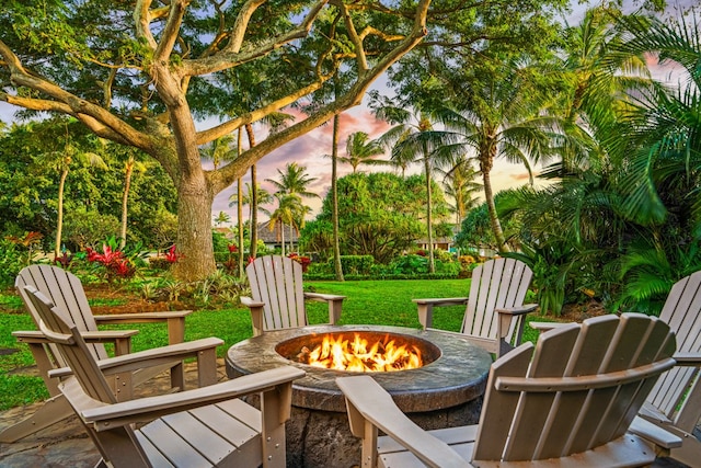5145 Lau Nahele St, Koloa, HI 96756 - patio terrace at dusk featuring a fire pit