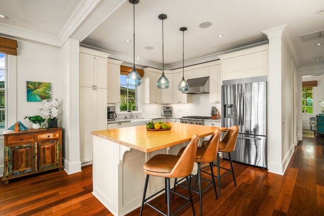 5145 Lau Nahele St, Koloa, HI 96756 - kitchen featuring stainless steel refrigerator with ice dispenser, crown molding, dark wood-type flooring, plenty of natural light, and recessed lighting
