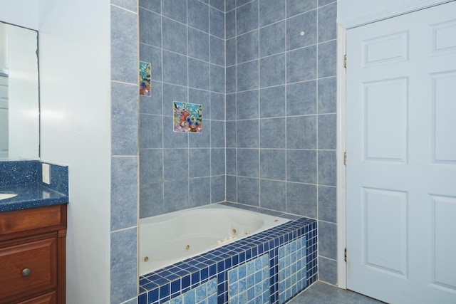 76 Makani Cir, Hilo, HI 96720 - full bathroom featuring a tub with jets, vanity, tile walls, and tile patterned floors