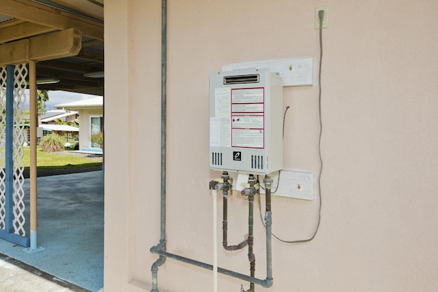 76 Makani Cir, Hilo, HI 96720 - exterior view of water heater and stucco siding