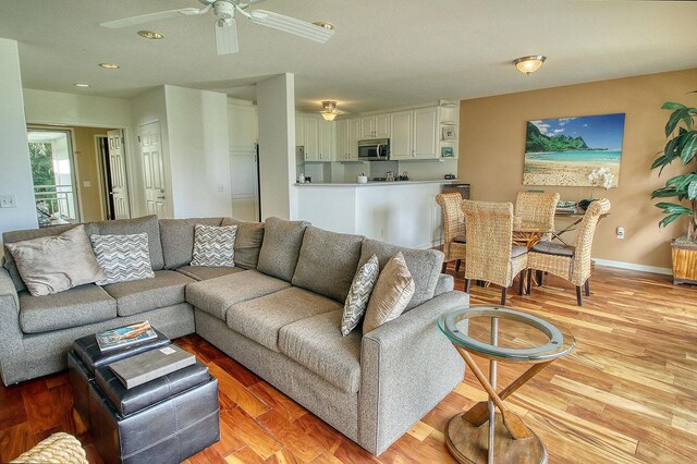 5250 Ka Haku Rd Unit 523, Princeville, HI 96722 - living room with a ceiling fan, recessed lighting, baseboards, and light wood-type flooring