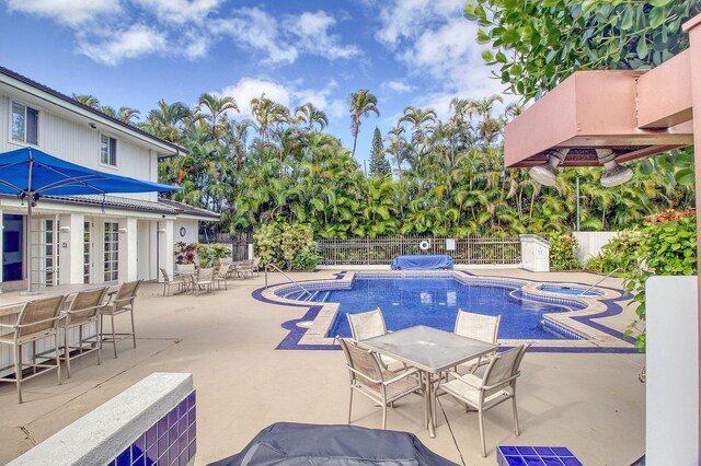 5250 Ka Haku Rd Unit 523, Princeville, HI 96722 - view of pool with a patio, outdoor dining area, and an in-ground hot tub