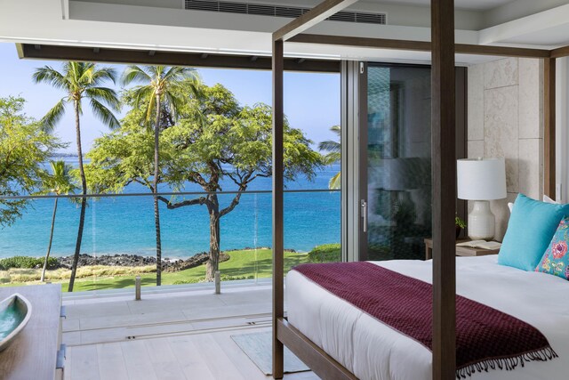 66-84 Kaunaoa Dr Unit C41, Kamuela, HI 96743 - bedroom featuring a water view, multiple windows, and wood finished floors