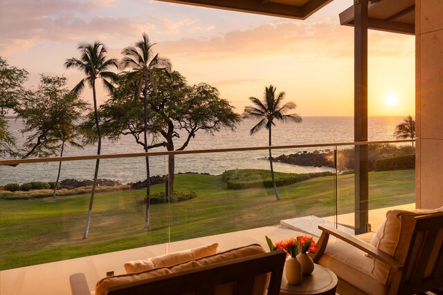66-84 Kaunaoa Dr Unit C41, Kamuela, HI 96743 - patio terrace at dusk featuring a water view, outdoor lounge area, and a lawn