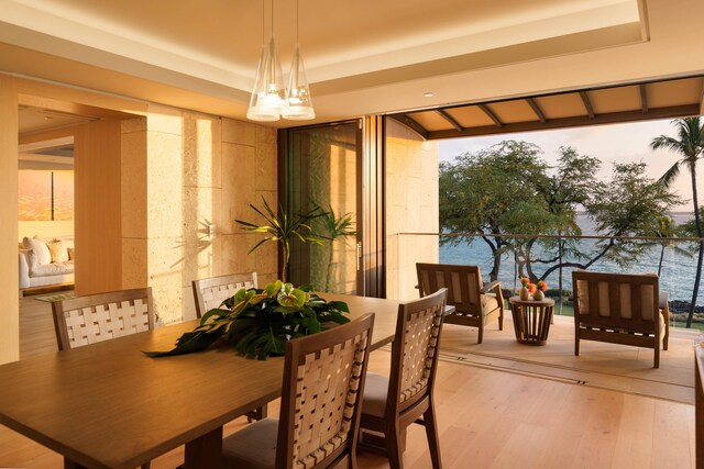 66-84 Kaunaoa Dr Unit C41, Kamuela, HI 96743 - dining area with a raised ceiling, light wood-style floors, and plenty of natural light