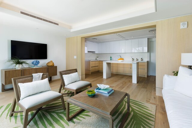 66-84 Kaunaoa Dr Unit C41, Kamuela, HI 96743 - living area with a raised ceiling and light wood-type flooring