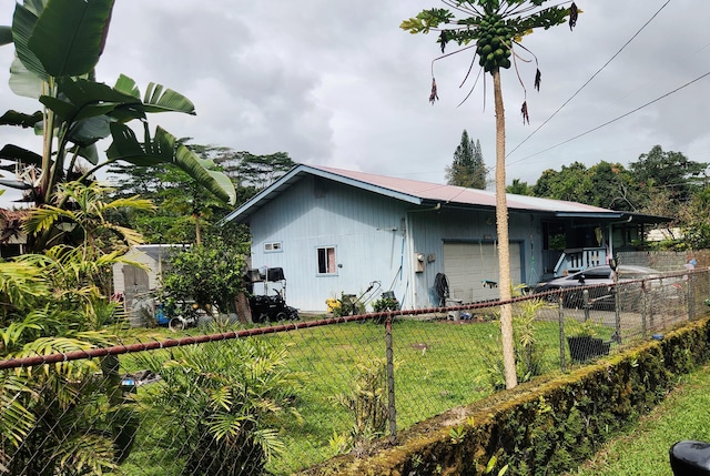 15-2774 Aweoweo St, Pahoa, HI 96778 - view of property exterior with an attached garage