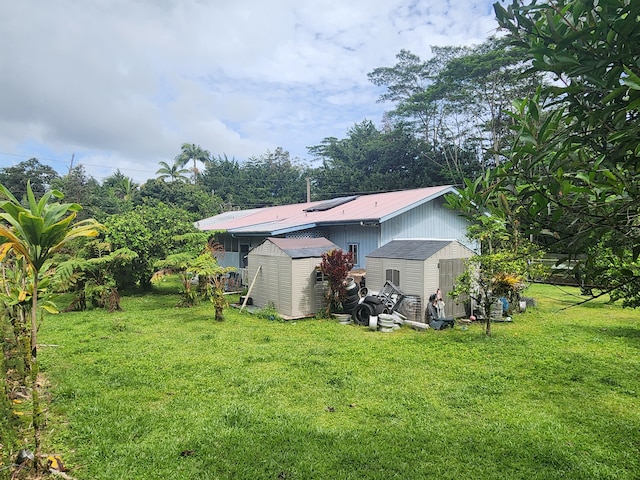 15-2774 Aweoweo St, Pahoa, HI 96778 - back of house featuring a lawn and metal roof