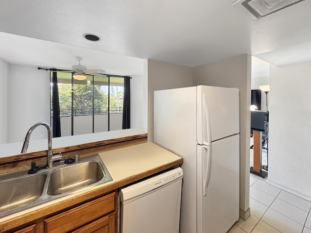 77-6469 Alii Dr Unit 128, Kailua-Kona, HI 96740 - kitchen featuring white appliances, a sink, brown cabinets, and light tile patterned floors