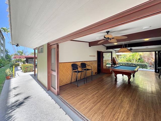 77-6469 Alii Dr Unit 128, Kailua-Kona, HI 96740 - playroom featuring a wainscoted wall, wood finished floors, billiards, and a ceiling fan