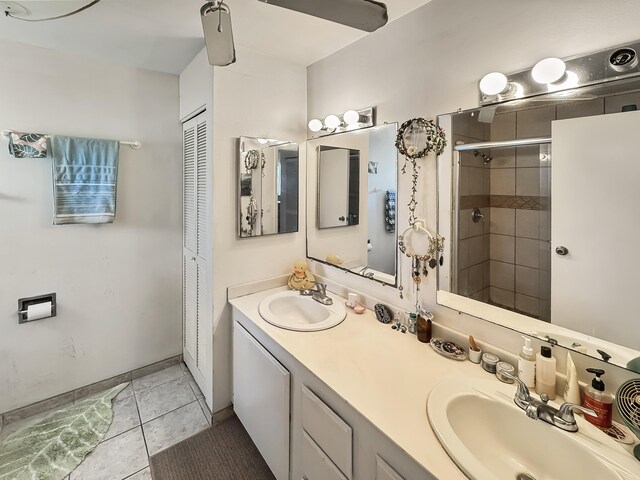 77-6311 Alii Dr Unit 306, Kailua-Kona, HI 96740 - bathroom featuring double vanity, a tile shower, tile patterned flooring, and a closet