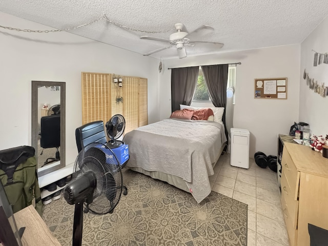 77-6311 Alii Dr Unit 306, Kailua-Kona, HI 96740 - bedroom featuring ceiling fan, a textured ceiling, and light tile patterned flooring