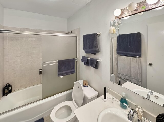 77-6311 Alii Dr Unit 306, Kailua-Kona, HI 96740 - bathroom featuring toilet, shower / bath combination with glass door, and vanity