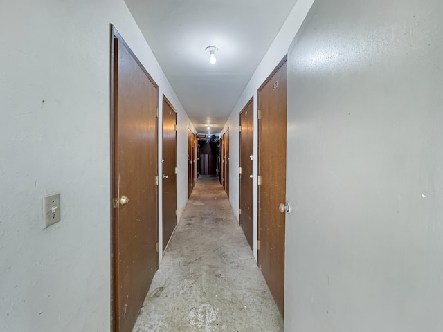 77-6311 Alii Dr Unit 306, Kailua-Kona, HI 96740 - corridor featuring unfinished concrete floors