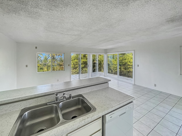 77-6311 Alii Dr Unit 301, Kailua-Kona, HI 96740 - kitchen featuring dishwasher, a sink, light tile patterned floors, light countertops, and a textured ceiling