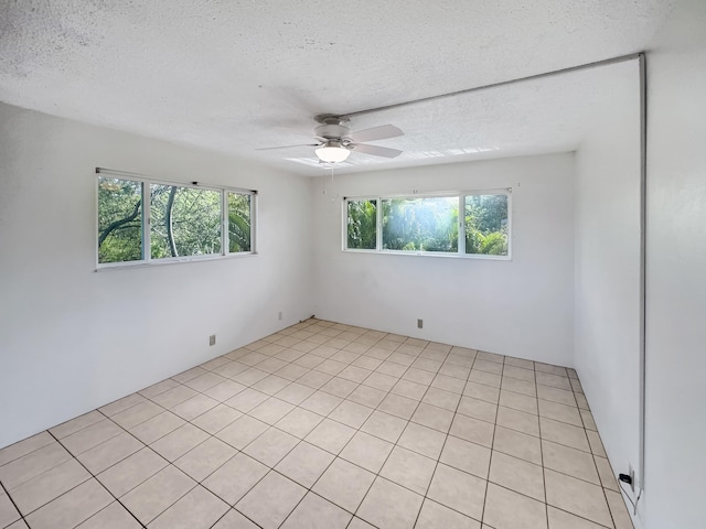 77-6311 Alii Dr Unit 301, Kailua-Kona, HI 96740 - empty room with ceiling fan and a textured ceiling