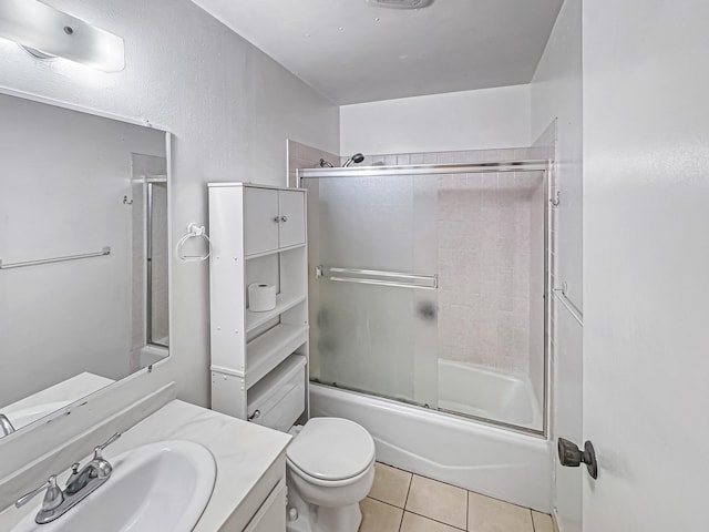 77-6311 Alii Dr Unit 301, Kailua-Kona, HI 96740 - full bath featuring vanity, tile patterned floors, toilet, and bath / shower combo with glass door
