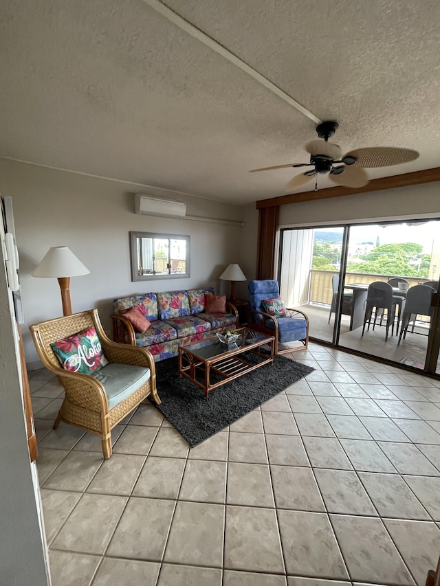 75-5719 Alii Dr Unit 409, Kailua-Kona, HI 96740 - living area featuring a wall mounted air conditioner, light tile patterned flooring, a textured ceiling, and ceiling fan