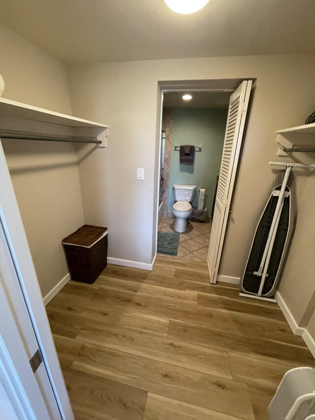 75-5719 Alii Dr Unit 409, Kailua-Kona, HI 96740 - walk in closet with light wood finished floors
