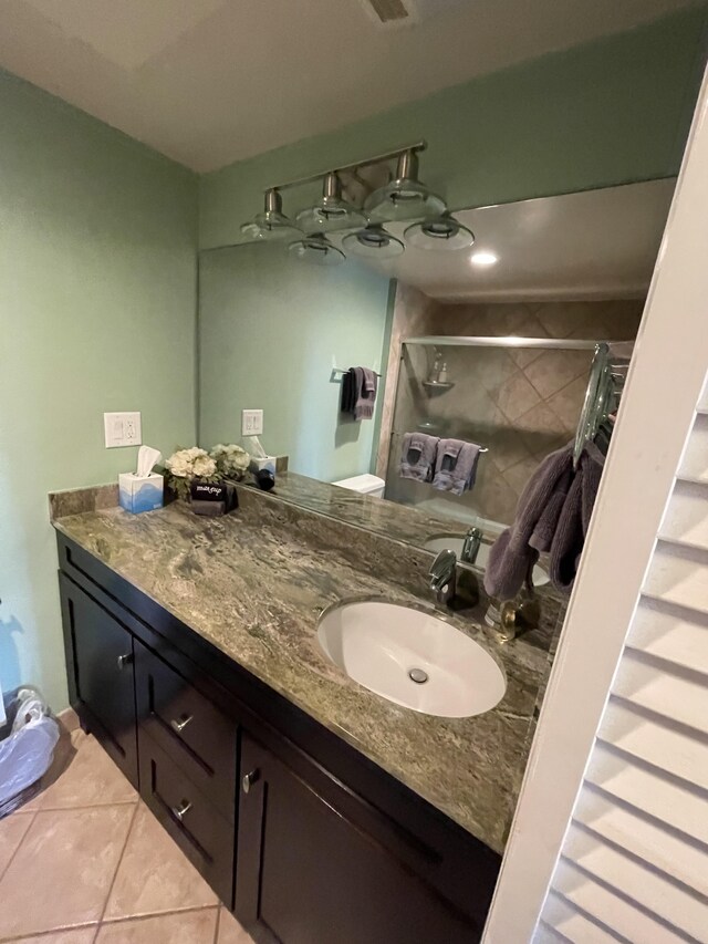 75-5719 Alii Dr Unit 409, Kailua-Kona, HI 96740 - bathroom with vanity, tile patterned floors, and a shower stall