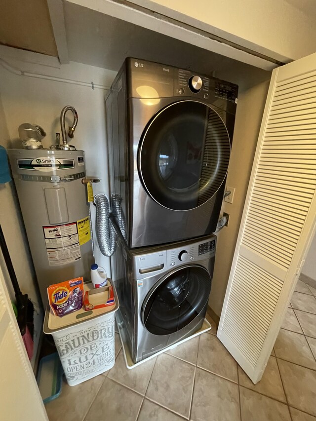 75-5719 Alii Dr Unit 409, Kailua-Kona, HI 96740 - laundry area with estacked washer and dryer, tile patterned floors, and electric water heater